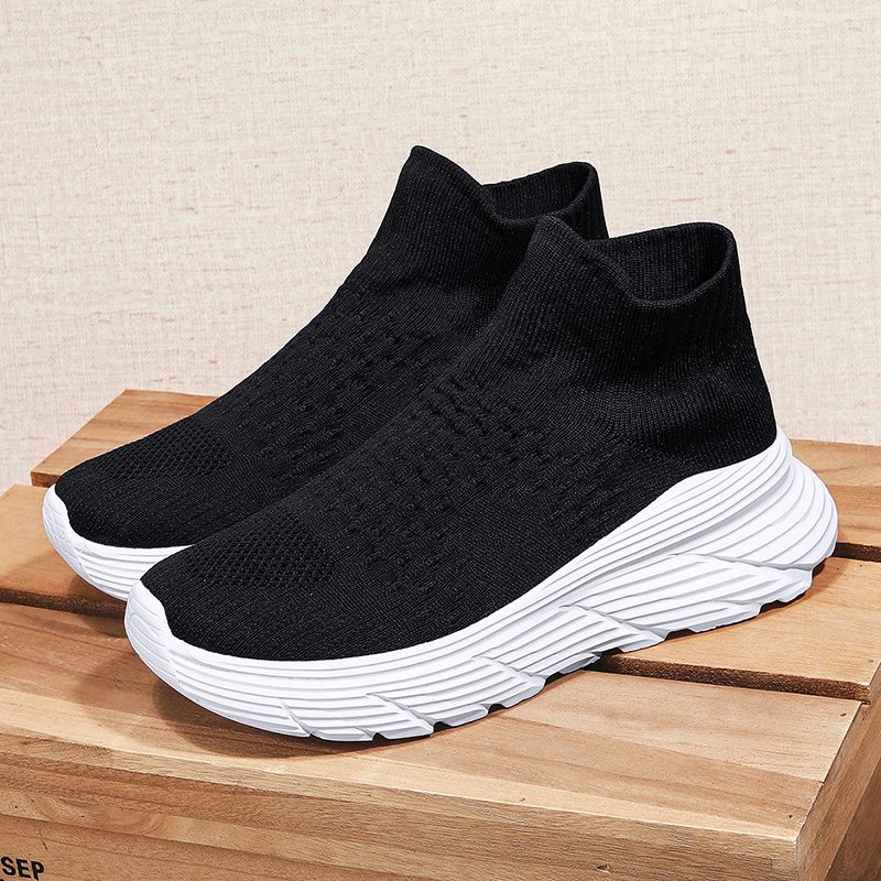 Mid-cut black crew knit sock shoe with white wave sole
