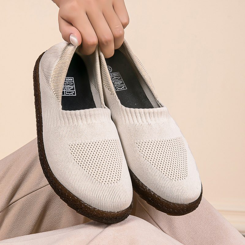 Brown slip-on knitted shoe with white sole